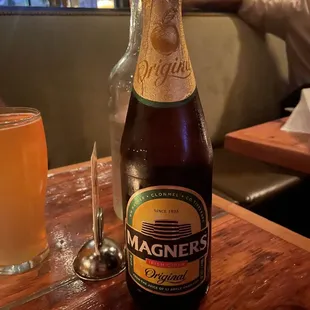 a beer bottle and a glass on a table