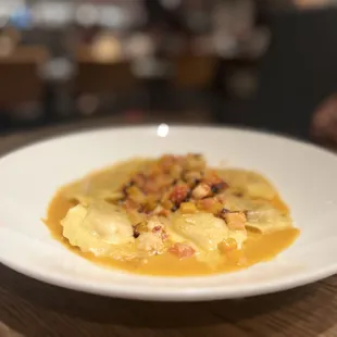 Season Butternut Squash ravioli with shrimp and lobster