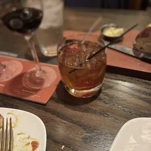  a plate of food and a glass of wine