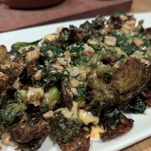Crispy brussel sprouts. Came w cilantro (not listed on the menu) and I am allergic.