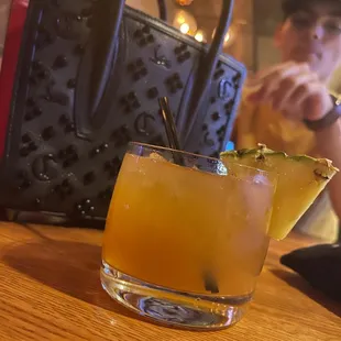 Double Remi Martin with pineapple juice.