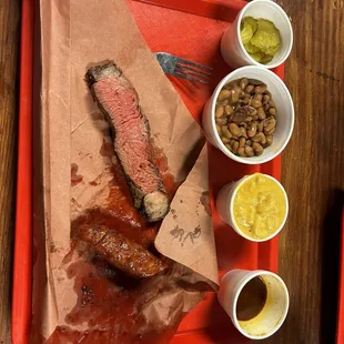 Sausage, top sirloin, macaroni and cheese, beans, picks and BBQ sauce.