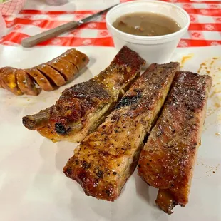 Pork ribs, jalapeño-cheddar sausage, and cowboy beans (free).