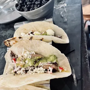 Steak tacos. I wish you could mix and match the taco fillings. Very good though. Black beans and rice on the side.