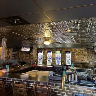 The bar, dart boards, and general area