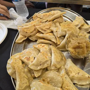 Shared plate of cheeseburger, peach pulled pork, and chicken parmesan. Yum!