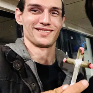 a man with a cigarette in his hand