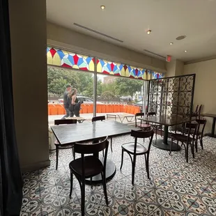 a dining room with a view of a patio