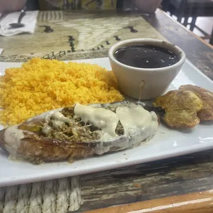 Stuffed plantain with beef !Yellow rice &amp; black beans ! Also fried plantain