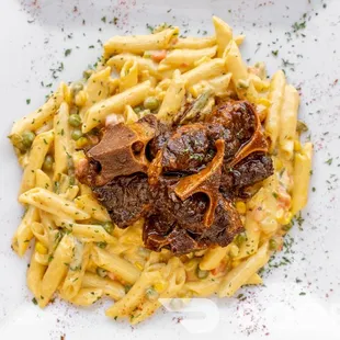 a plate of pasta with meat