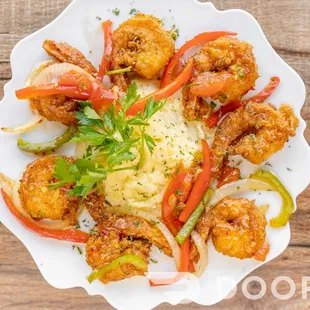 a plate of shrimp and vegetables