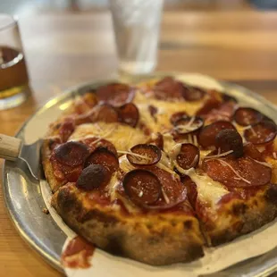 Classic pepperoni and a vanilla smoked Manhattan.