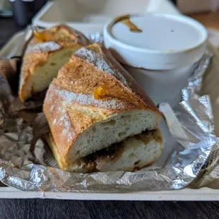 French dip sandwich. Sando is decent but the au jus is wayyyyyyy too salty.