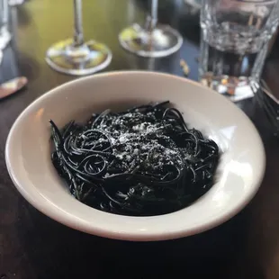 Squid ink pasta with black garlic and greens