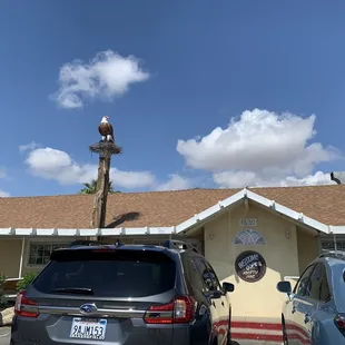 two cars parked in front of the building