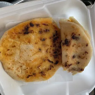 two tortillas in a styrofoam container