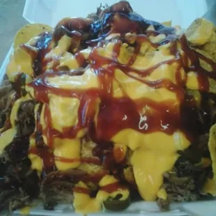 The fender bender. your choice of fries or homemade tortilla chips with pork or chicken, jalapenos or banana peppers, your choice of sauce