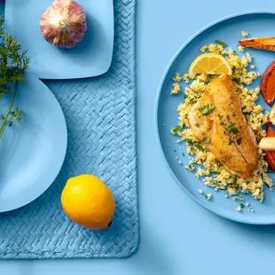 a plate of food on a blue place mat