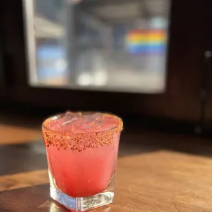 a pink cocktail in a glass