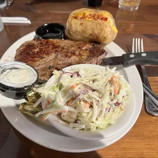Saturday Ribeye Special with loaded baked potato, Cole slaw and steak bourbon sauce