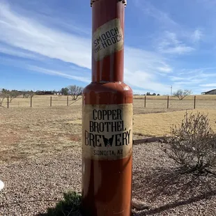 a bottle of beer on the ground