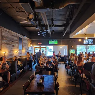 a large group of people sitting at tables