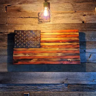 a rustic american flag on the wall