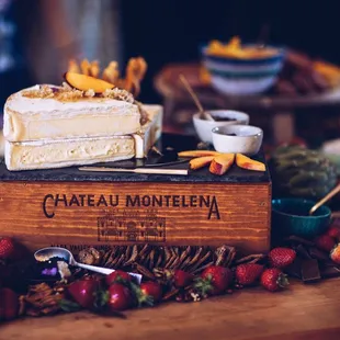 Brie topped with honey comb and peaches