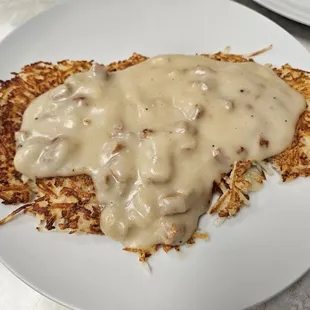 Side order of hashbrowns with country gravy on top