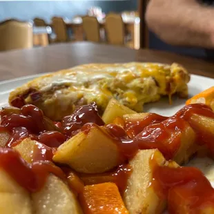 a plate of food with a slice of pizza