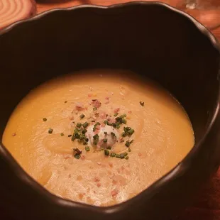Pumpkin Soup garnished with lime, cumin, and cardamom goat yogurt
