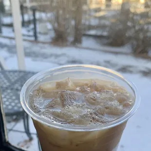 a cold beverage in a plastic cup
