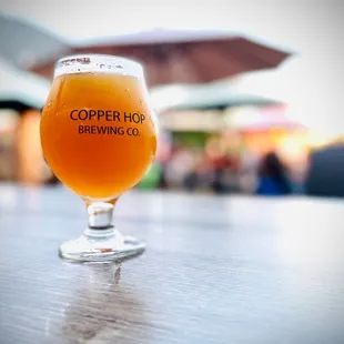 a glass of beer on a table