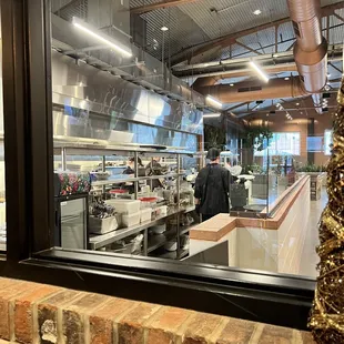 a kitchen with a christmas tree in the foreground