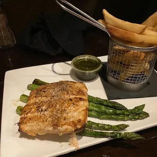 pan seared salmon  fresh filet, herb pesto drizzle, choice of 2 sides (Asparagus and French fries)