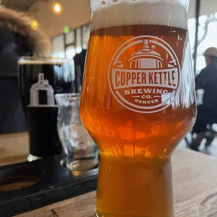 a glass of beer on a table