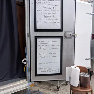 a refrigerator with a roll of toilet paper in front of it