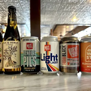 a variety of beers on a counter