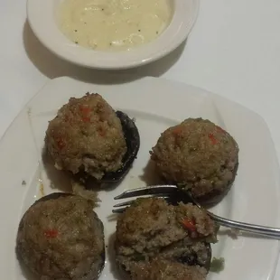 Sausage stuffer mushrooms with the sauce on the side.