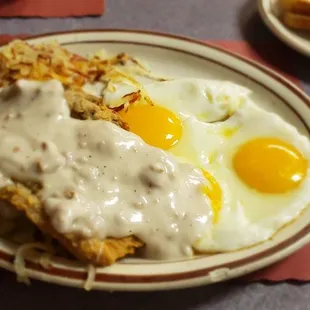 Country fried steak with mangled eggs