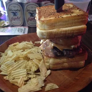 Oh my, the heart attack burger: cheese, sausage, bacon, onion rings, and tomboys and island between 2 grilled cheese sandwiches.