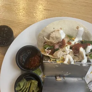 Boring chicken Tacos.  Salsa no spice no flavor, Guac - same, beans straight out of a can and the portion...what a joke.