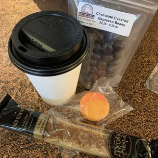 House blend coffee, apricot macaron, chocolate covered espresso beans, and pumpkin spice biscotti