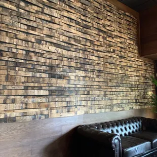 I'm so in love with this accent wall, made of whiskey barrels.