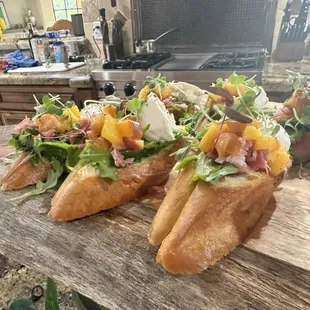 Grilled peach Barata, arugula, and prosciutto bruschetta.