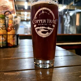 a pint glass on a table