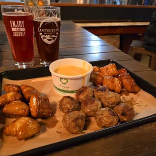 a tray of chicken wings and dipping sauce