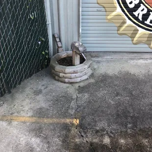 a fire hydrant in front of a closed door