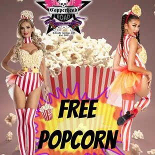 two women in costumes and popcorn