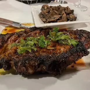 a steak on a white plate